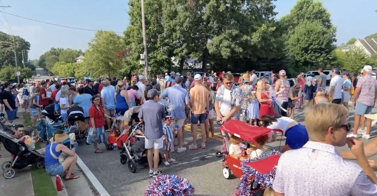 Crowds line the walking parade route at Milton's Red, White, and YOU! celebration